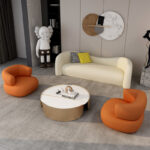 اريكة مخملية بتصميم انحنائي