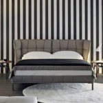 سرير بتصميم حديث مغطي بالقماش