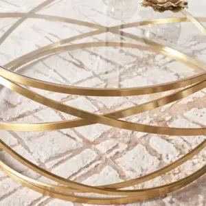 طاولة قهوة دائرية بتصميم ملتف وسطح زجاجي